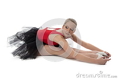 Ballerina makes stretching exercises Stock Photo