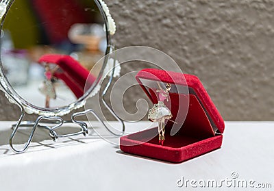 Ballerina pendant in a red case reflected in a mirror Stock Photo