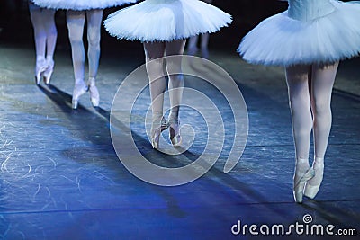 Ballerinas in the movement. Feet of ballerinas close up. Stock Photo