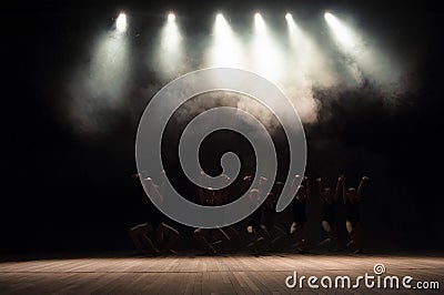 Ballet class on the stage of the theater with light and smoke. Children are engaged in classical exercise on stage Stock Photo