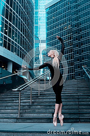 Ballet dancer, ballerina dancing on the city street. Artist. Stock Photo