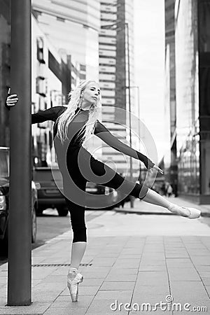 Ballet dancer on the city street. Ballerina Stock Photo