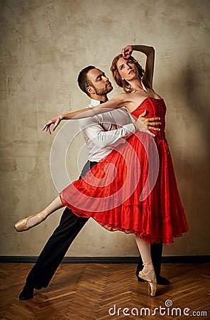 Ballet dancer and latin dancer mix the styles together. Stock Photo