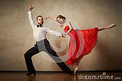 Ballet dancer and latin dancer mix the styles together. Stock Photo