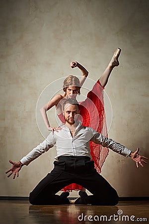 Ballet dancer and latin dancer mix the styles together. Stock Photo