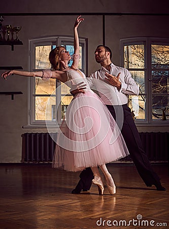 Ballet dancer and latin dancer mix the styles together. Stock Photo