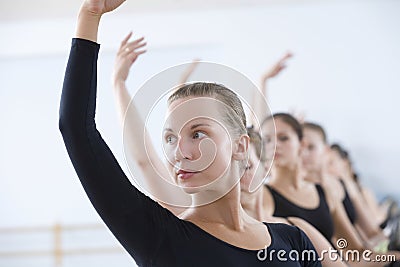 Ballet Dancers Practicing At The Barre Stock Photo