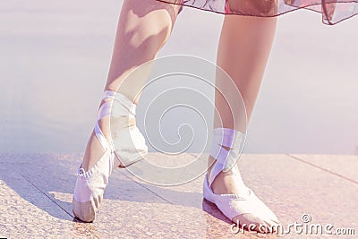 Ballet shoes for dancing shod on their feet dancer girls Stock Photo