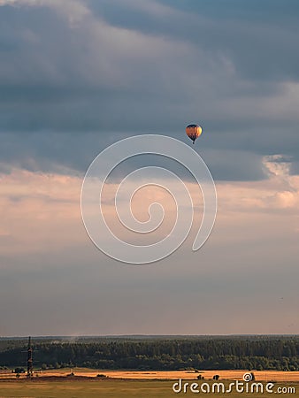 Balloon flights over the field in the evening Stock Photo