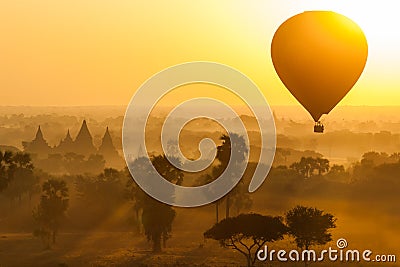 Balloon over plain of Bagan in misty morning, Myanmar Stock Photo