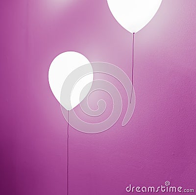 Balloon shape lamp on wall Stock Photo