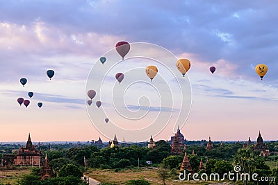 Balloons flying over the pagodas at sunrise at Bagan, Myanmar Editorial Stock Photo