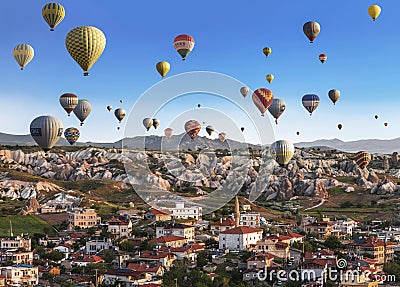 Balloons flying over the small town of Goreme in Cappadocia, Editorial Stock Photo
