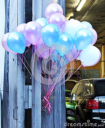 Balloons tethered in the street Stock Photo