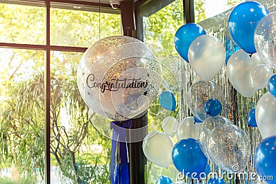 Balloons with word Congratulation on ballon decoration in the restaurant. Stock Photo