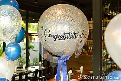 Balloons with word Congratulation on ballon decoration in the rsetaurant. Stock Photo