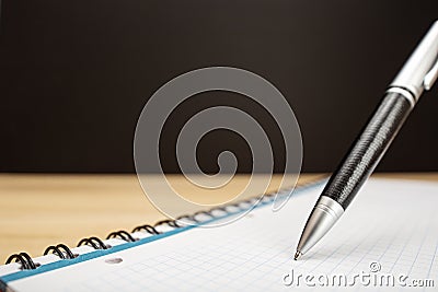 Ballpen and notebook close up Stock Photo