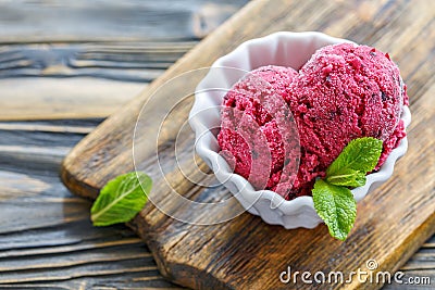 Balls of homemade ice cream of black currant. Stock Photo