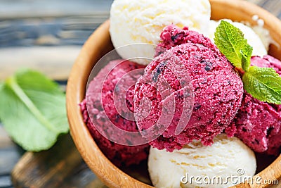 Balls lemon and berry ice cream in a bowl close up. Stock Photo