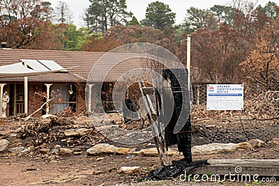 Australian bushfire aftermath: Burnt and damaged property with Hazard Identification Notice Editorial Stock Photo