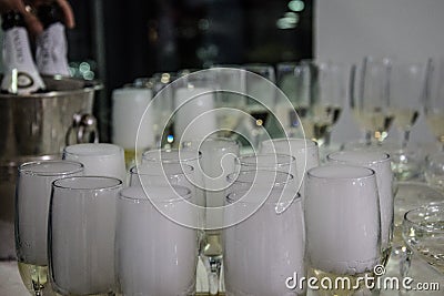 Bals / Romania / December 27, 2018: Group of champagne glasses full with drinks and foam Editorial Stock Photo