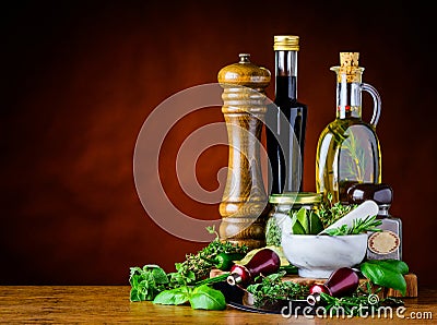 Balsamic Vinegar, Olive Oil and Green Herbs Stock Photo