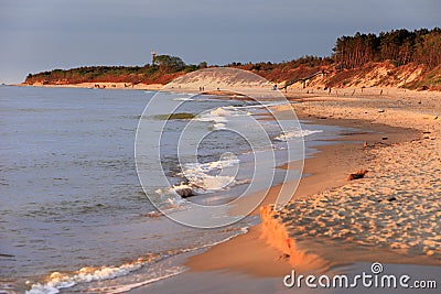 Baltic Sea shore line and beach in Rowy, Poland during sunset Stock Photo