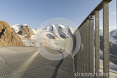 Balustrade in the alps with glacier covered mountains Stock Photo