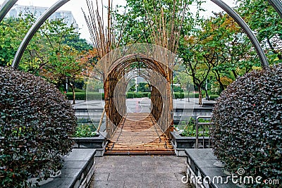 Bamboo arch-shaped pedestrian bridge in Kowloon Park, Hong Kong Stock Photo