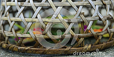 bamboo basket used to protect balinese offering from rural chicken Stock Photo