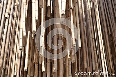 Bamboo canes pending in a large group of objects gathered together. Stock Photo