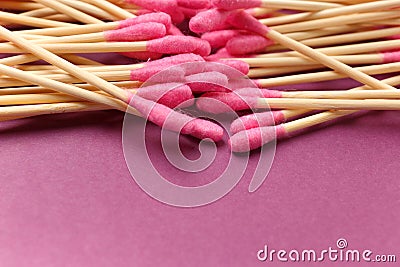Bamboo cotton swabs buds sticks on a purple background, close-up Stock Photo