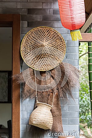 Bamboo craft tool for catch fish with Coir raincoat Stock Photo