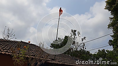 Bamboo Gudhi hoisted outside home in konkan Stock Photo