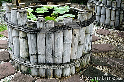 A bamboo made is a pond with lotus flower in the park, classic stlye concept Stock Photo