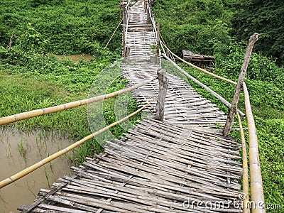Bamboo pathway in the middle of paddy fields, bamboo walkway and footbridge Stock Photo