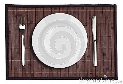 Bamboo placemat with plate fork and knife Stock Photo