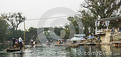 Bamboo rafting along Yulong River during the winter season with beauty of the landscape is a popular activity in Guilin. Editorial Stock Photo