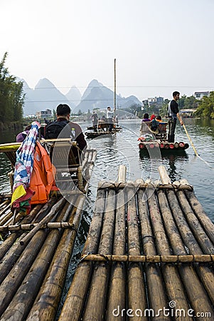 Bamboo rafting along Yulong River during the winter season with beauty of the landscape is a popular activity in Guilin. Editorial Stock Photo