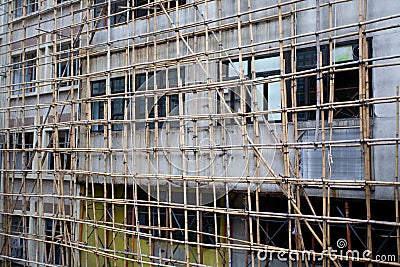 Bamboo scaffolding in front of the building. Stock Photo