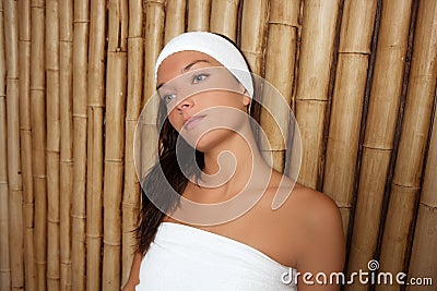 Bamboo spa woman sitting relaxed after treatment Stock Photo
