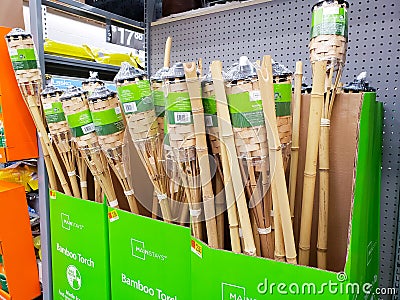 Bamboo tiki torches at store Editorial Stock Photo