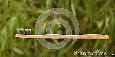 Bamboo tooth brush on banboo background Stock Photo