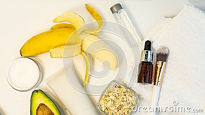 Banana and avocado for a handmade face mask and ingredients on a white table. Skin care. Stock Photo