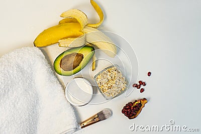 Banana and avocado for a handmade face mask and ingredients on a white table. Skin care. Homemade natural ingredients for Stock Photo