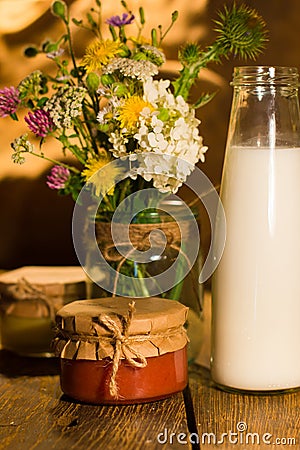 Banana and grapefruit jam in jars and milk in the bottle Stock Photo