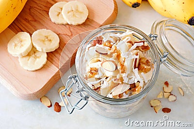 Banana nut overnight oats in glass canning jar, downward view Stock Photo