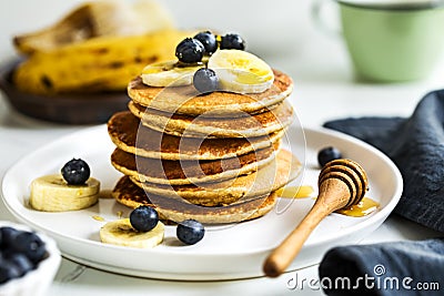 Banana, Oat Pancakes with fresh Blueberry and Banana Stock Photo
