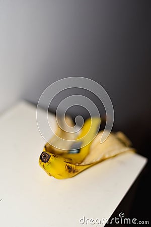 Banana Peel on Desk, Conceptual, Abstract Photography Stock Photo