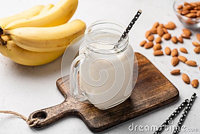 Banana protein smoothie in drinking glass Stock Photo
